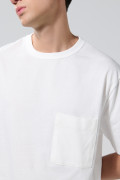 Camiseta oversize unicolor con bolsillo y cuello redondo