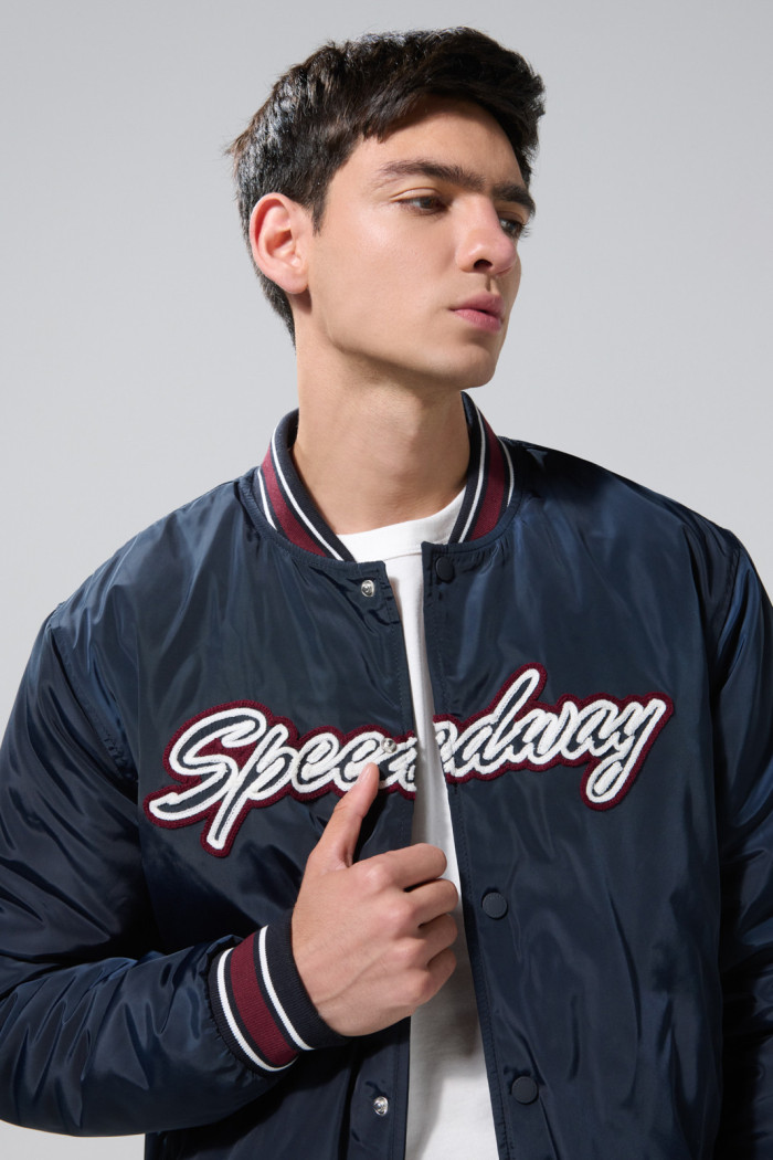 Chaqueta bomber college azul intensa con rectilíneos