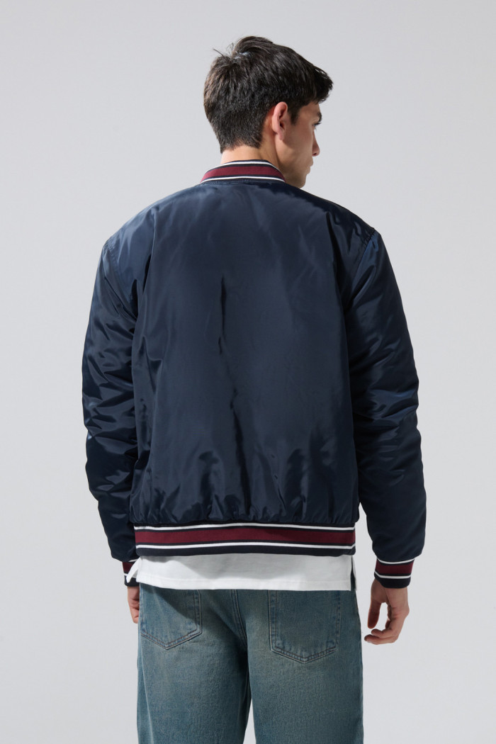 Chaqueta bomber college azul intensa con rectilíneos